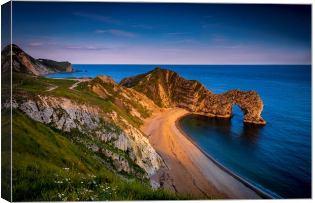 Jurassic coast and Durdle Door in Dorset at sunset Canvas Print by Alan Hill