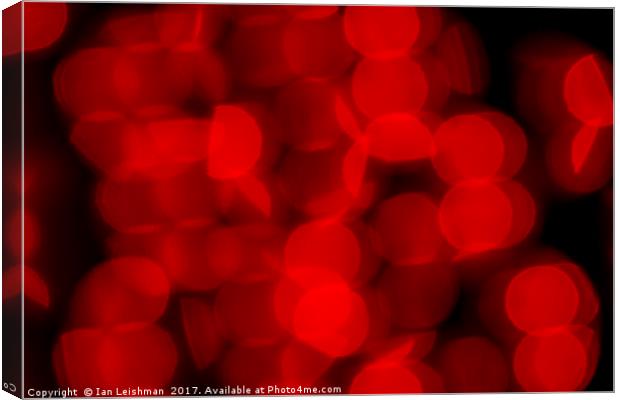 Red Circles of Bokeh on Black Canvas Print by Ian Leishman