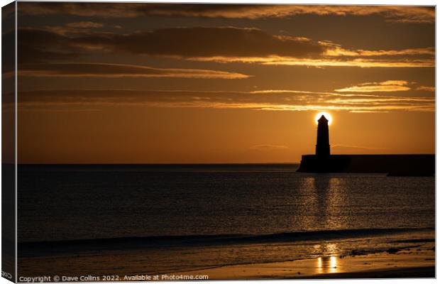 Sunrise behind the light tower at the entrance of Berwick upon tweed harbour Canvas Print by Dave Collins