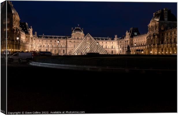 The Louvre illuminated at night from Place Du Carrousel, Paris, France Canvas Print by Dave Collins