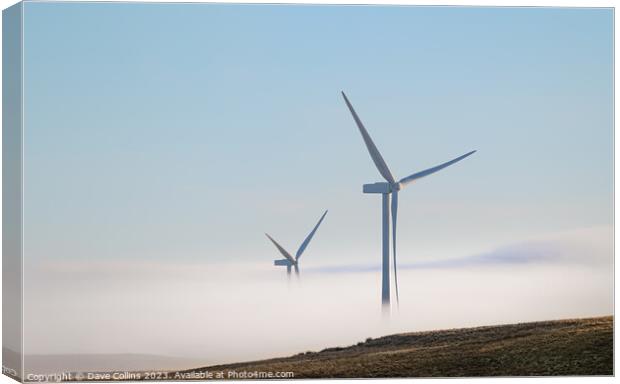 Wind Turbines in the mist in the hills of Northumberland, England Canvas Print by Dave Collins