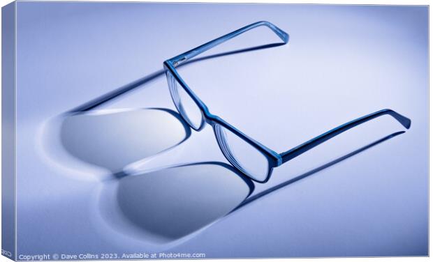 Artistic blue toned pair of blue glasses with shadows Canvas Print by Dave Collins