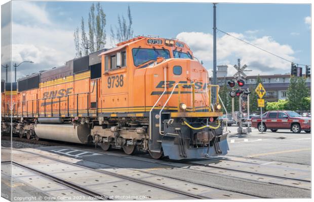 BNSF freight train passing through Seattle along Alaskan Way highway, Seattle, USA Canvas Print by Dave Collins