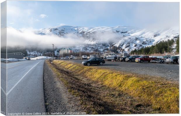 The main car and boat trailer parking area in Whittier with the  Begich Towers Condominium building and fog and snow mountains , Whittier, Alaska, USA Canvas Print by Dave Collins