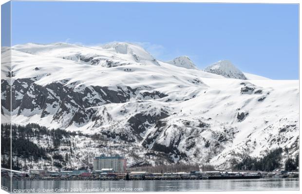 The Begich Towers Condominium building and snow covered mountains behind, Whittier, Alaska, USA Canvas Print by Dave Collins