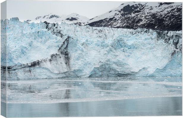 The ice and moraines at the front of a glacier, Alaska, USA Canvas Print by Dave Collins