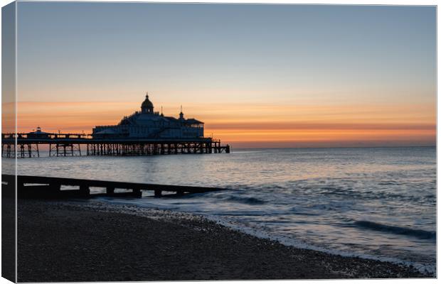 Sunrise over Eastbourne Pier, East Sussex, England Canvas Print by Dave Collins