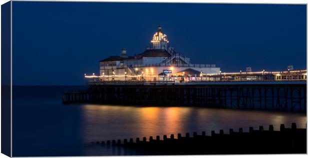 Eastbourne Pier At Night Canvas Print by Dave Collins