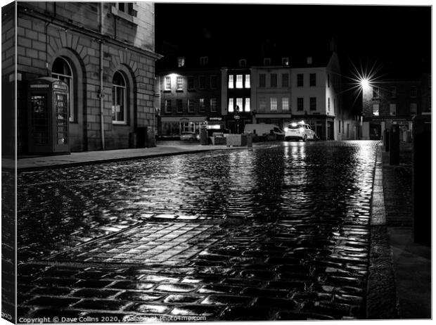 Rain soaked cobbled street at night, Kelso, Scotla Canvas Print by Dave Collins