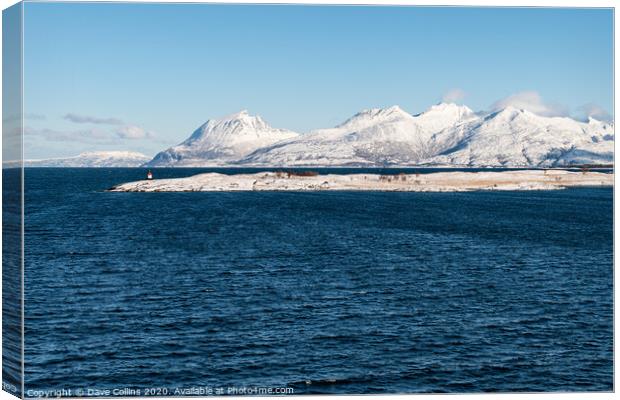 Snow covered hills on the Norwegian Coast in winter Canvas Print by Dave Collins