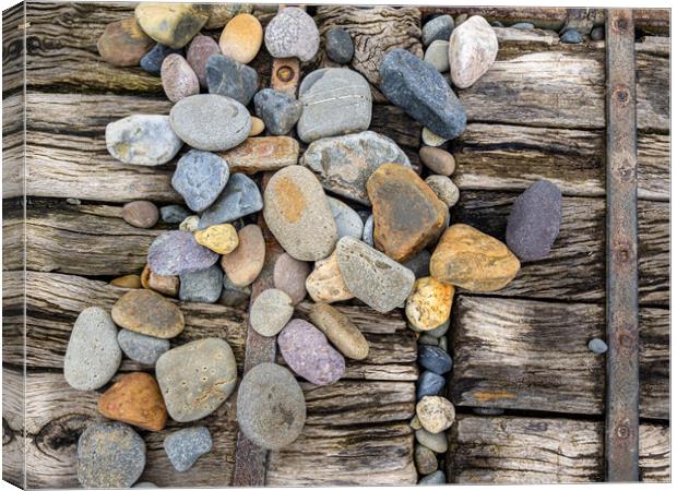 Newgale - Pebbles on the Boardwalk. Canvas Print by Colin Allen