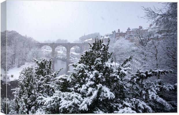 Winter snow over the river Nidd and famous landmark railway viaduct in Knaresborough, North Yorkshire. Canvas Print by mike morley