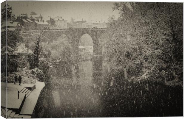 Winter snow over the river Nidd and famous landmark railway viaduct in Knaresborough, North Yorkshire Canvas Print by mike morley