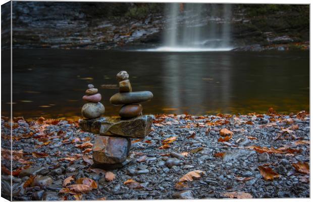 Stacking stones at the Lady Falls. Canvas Print by Bryn Morgan