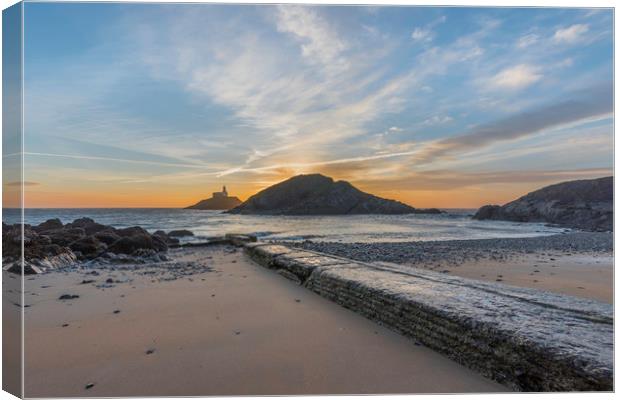 Sunrise at Mumbles lighthouse from the small bay. Canvas Print by Bryn Morgan