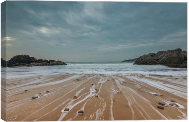 Pebbles on the beach at Rotherslade bay. Canvas Print by Bryn Morgan