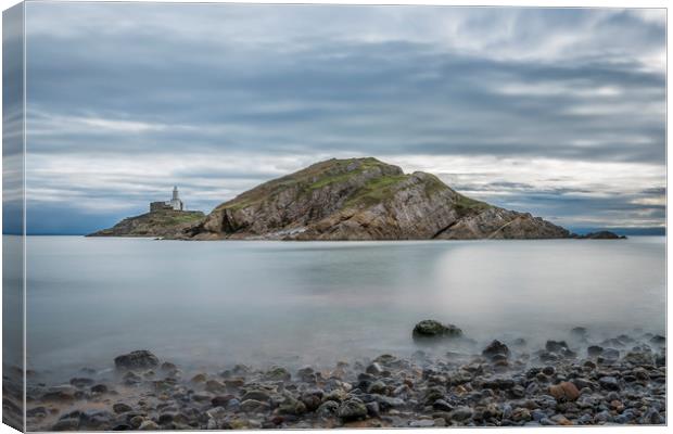 Mumbles lighthouse from the little bay. Canvas Print by Bryn Morgan
