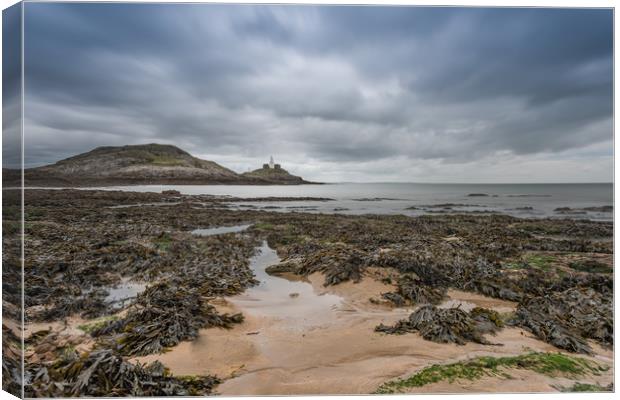 Mumbles lighthouse with the tide going out. Canvas Print by Bryn Morgan