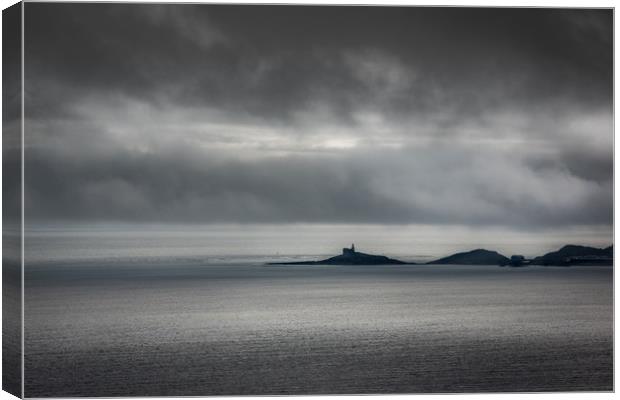 Mumbles lighthouse on a cloudy day. Canvas Print by Bryn Morgan