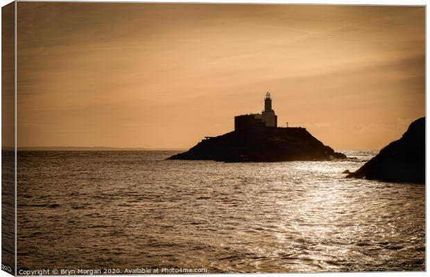 Mumbles lighthouse at sunrise Canvas Print by Bryn Morgan