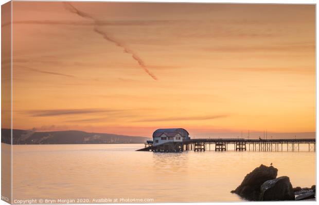 Mumbles pier and old lifeboat house viewed from Knab rock Canvas Print by Bryn Morgan
