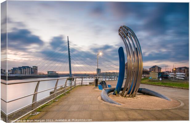 Sail bridge at Swansea marina with sculpture in foreground Canvas Print by Bryn Morgan