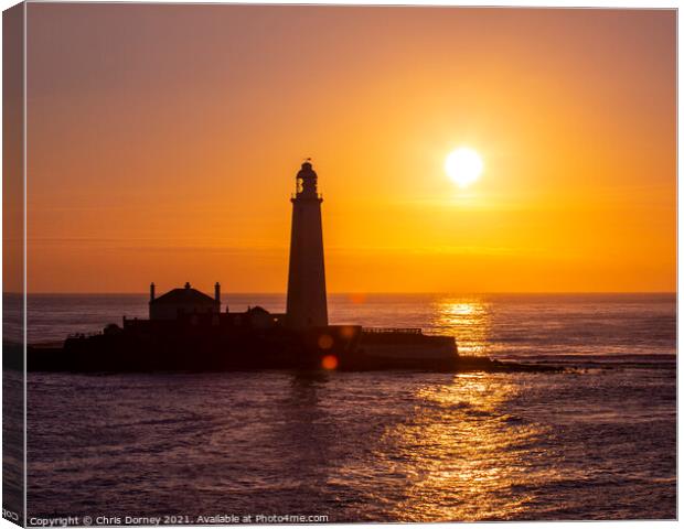 Sunrise at St. Marys Lighthouse in Northumberland, UK Canvas Print by Chris Dorney