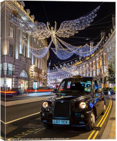 Taxi with Regent Street Christmas Lights in London, UK Canvas Print by Chris Dorney