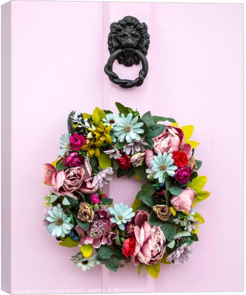 Wreath on a Pink Door Canvas Print by Chris Dorney