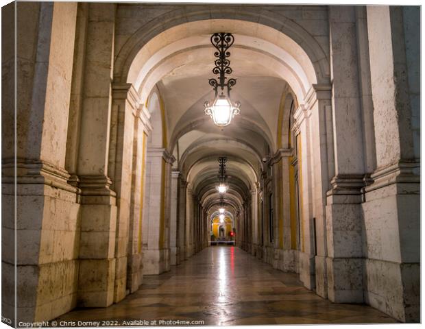Arched Walkways at Praca do Comercio in Lisbon, Portugal Canvas Print by Chris Dorney