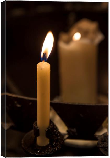 Illuminated Candle Canvas Print by Chris Dorney