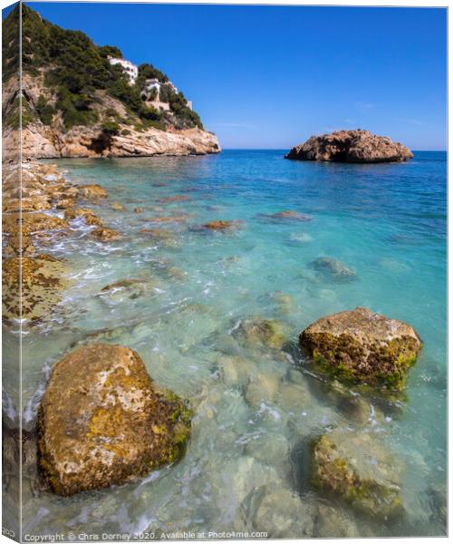 Ambolo Beach in Javea Canvas Print by Chris Dorney