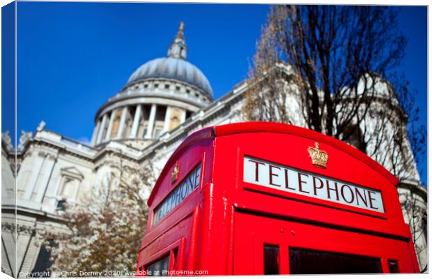 Red Telephone Box outside St. Paul's Cathedral in London Canvas Print by Chris Dorney