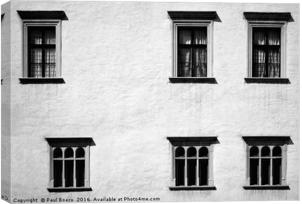 Windows in uneven rows Canvas Print by Paul Boazu