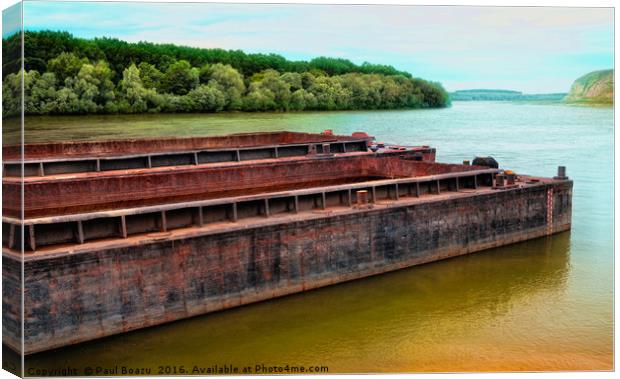 barges on the river  Canvas Print by Paul Boazu