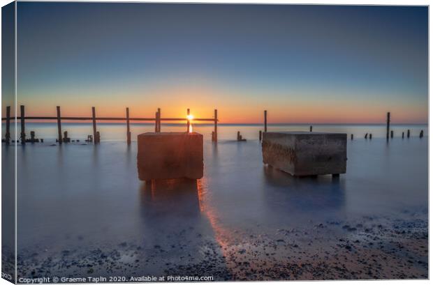 Sunrise over the sea defences Canvas Print by Graeme Taplin Landscape Photography