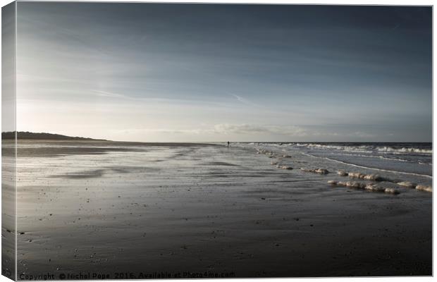 Lone Walker at Holme Next the Sea, Norfolk Canvas Print by Nichol Pope