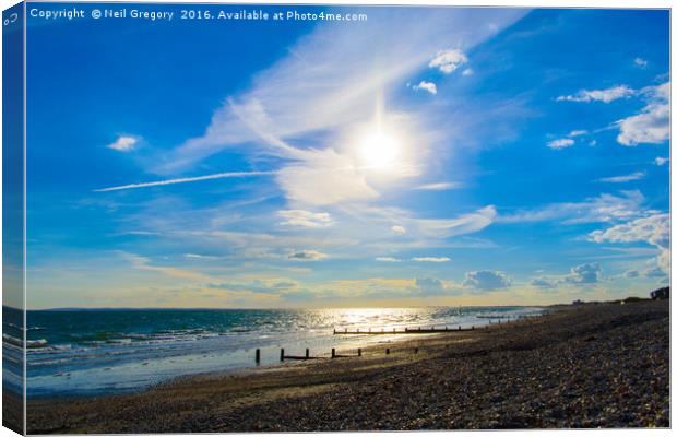 Beach Sun Set with Bright Blue Sky Canvas Print by Neil Gregory