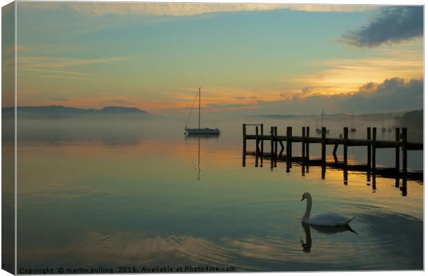 lonely swan on windermere Canvas Print by martin pulling