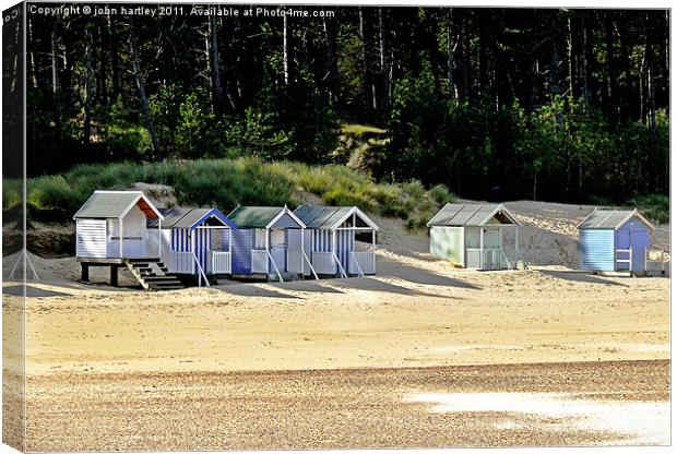 Holiday Fun - Beach Huts at Wells next the Sea, No Canvas Print by john hartley
