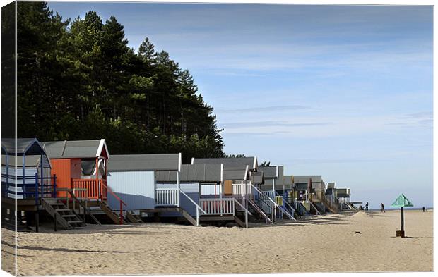 Happy Days ! Holiday Beach Huts on the Sand at Wel Canvas Print by john hartley