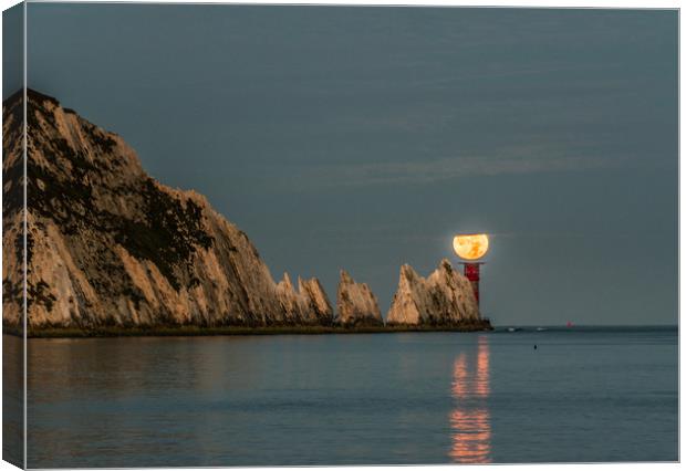 Moon setting over lighthouse Canvas Print by Alf Damp