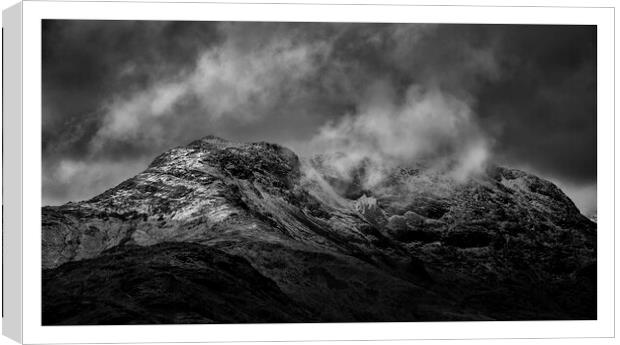 Langdales, Lake District covered in snow and cloud Canvas Print by Graham Binns