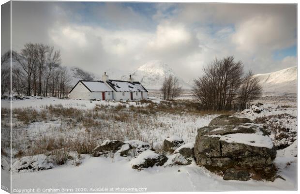 Black Rock Cottage, snowy Scottish scene. Glencoe Canvas Print by Graham Binns