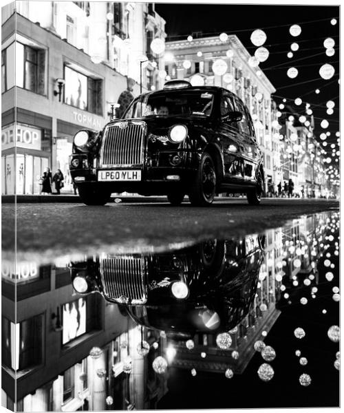 Taxi on Oxford Street Canvas Print by Jon Raffoul