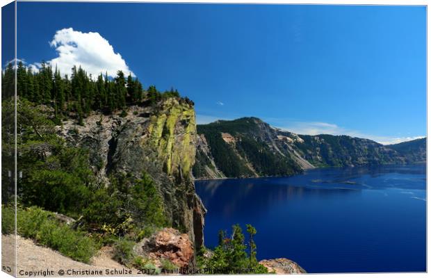 Crater Lake And Lava Cliff Canvas Print by Christiane Schulze