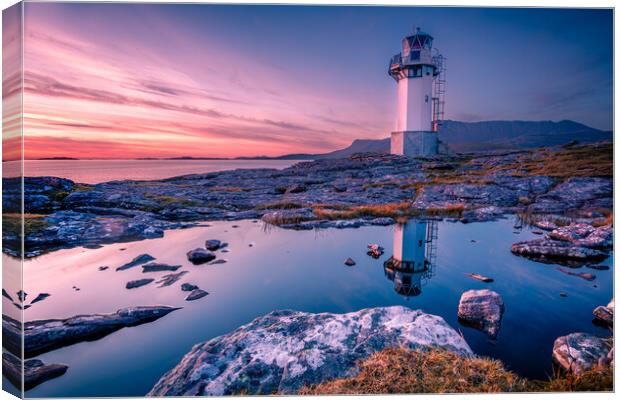 Golden Reflections of Rhue Lighthouse Canvas Print by John Frid
