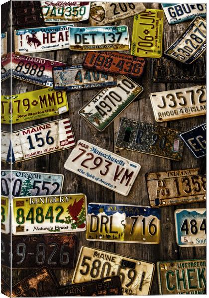 License Plates on Old Wall Canvas Print by Darryl Brooks