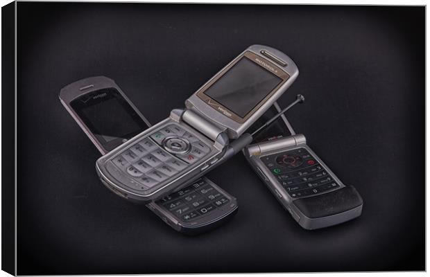 Three Flip Phones on Black Canvas Print by Darryl Brooks