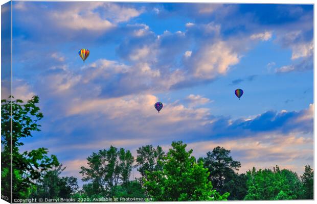 Three hot air balloons over trees Canvas Print by Darryl Brooks